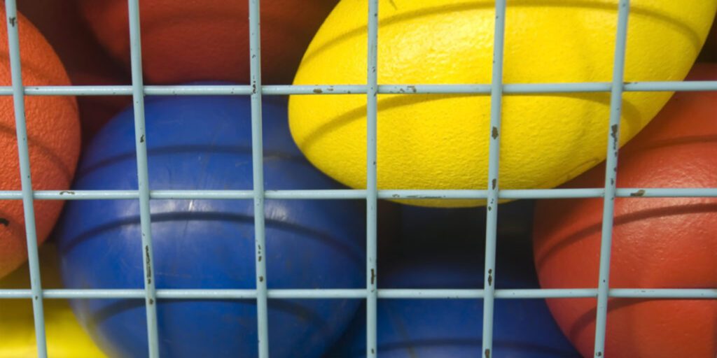 Athletic balls and sports equipment.